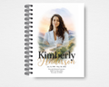 Quiet Wings watercolor religious memorial guest book — front cover with mountain landscape, portrait photo placeholder, name and dates, editable in Canva